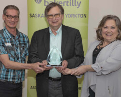 Doug Hall and Donna Brothwell from YBID present the Business Leader of the Year Award to Kenn Propp, Harvest Meats