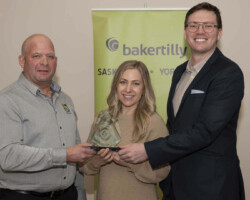 Lorrie Ulmer from RBC Royal Bank presents the Customer Service Award to Hearn's Westview Pharmacy