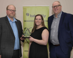 Ryan Hoffman from Baker Tilly presents the Small Business of the Year Award to The Medicine Shoppe Pharmacy