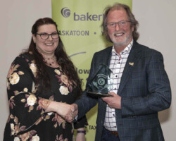 Yorkton Animal Health Centre accepts the Property Restoration Award sponsored by the City of Yorkton from Mayor Hippsley